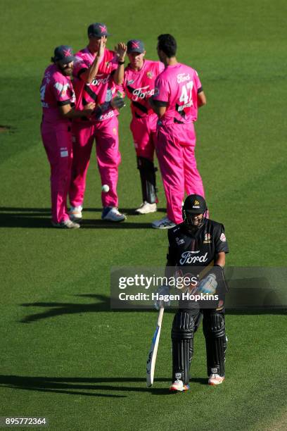 Jeetan Patel of the Firebirds leaves the field after being dismissed during the Twenty20 Supersmash match between the Firebirds and the Knights at...