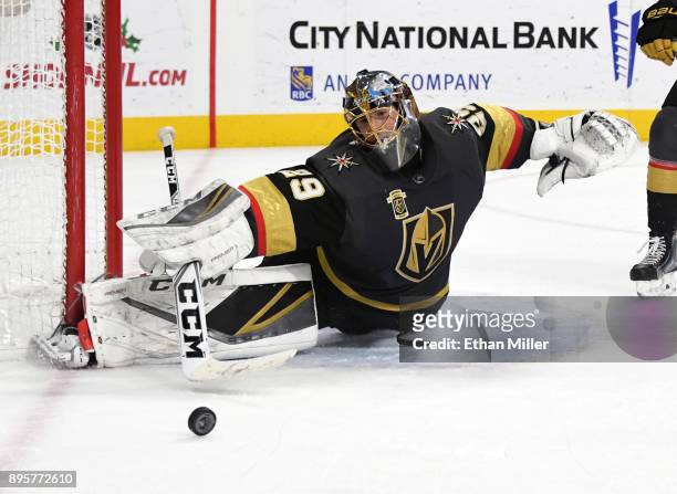 Marc-Andre Fleury of the Vegas Golden Knights blocks a Tampa Bay Lightning shot in the third period of their game at T-Mobile Arena on December 19,...