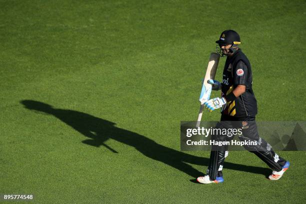 Jeetan Patel of the Firebirds leaves the field after being dismissed during the Twenty20 Supersmash match between the Firebirds and the Knights at...