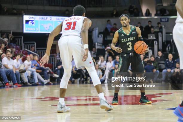 Cal Poly Mustangs guard Donovan Fields sets the play during the game between SMU and Cal Poly on December 19 at Moody Coliseum in Dallas, TX.