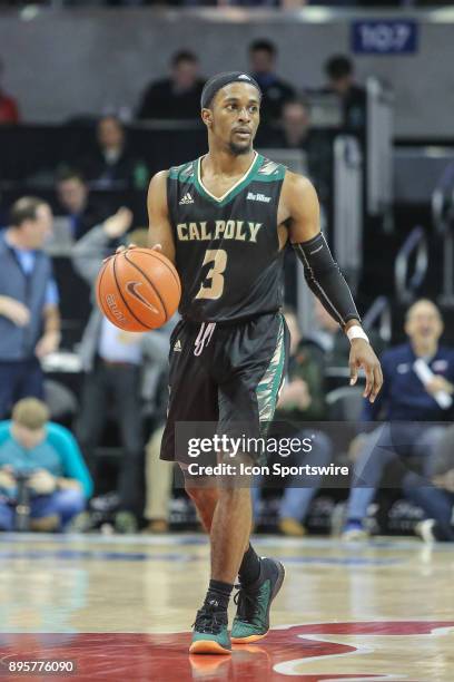 Cal Poly Mustangs guard Donovan Fields brings the ball up court during the game between SMU and Cal Poly on December 19 at Moody Coliseum in Dallas,...