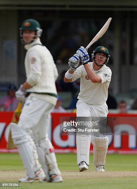 Australian batsman Marcus North hits a boundary as Michael Clarke looks on during day five of the npower 3rd Ashes Test Match between England and...