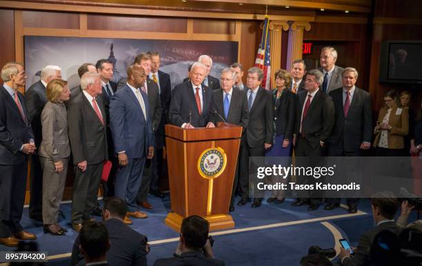 Senate Finance Committee chairman Orrin Hatch arrive at the press conference after the senate vote of the tax reform bill on December 20, 2017 in...