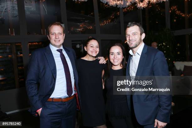 Daniel Scouler, Jessica Bates, Victoria Levine and Brandon Prust during the Azadian Group Holiday Party on December 19, 2017 in New York City.