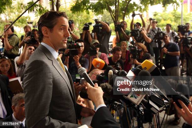 Attorney of Debbie Rowe, Eric George speaks to the press outside of Los Angeles Superior Court following a hearing to finalize an agreement for...