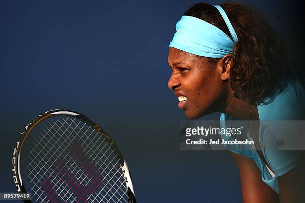 Serena Williams looks on during her doubles match with her sister Venus Williams, against Yi Chen of Taipei and Mashona Washington during the Bank of...