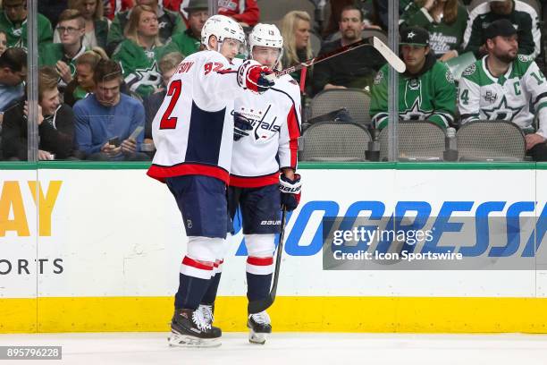 Washington Capitals center Evgeny Kuznetsov talks with left wing Jakub Vrana prior to a face-off during the hockey game between the Washington...