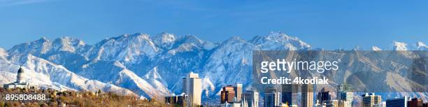 panoramic view of salt lake city with snow capped mountain - salt lake city stock pictures, royalty-free photos & images