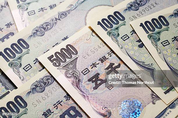 variations of japanese yen currency - five thousand yen note stock pictures, royalty-free photos & images