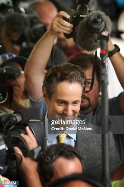 Attorney Eric George, who represents Debbie Rowe, smiles outside Los Angeles Superior Court where a hearing to finalize an agreement for permanent...