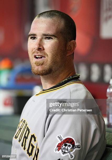 Catcher Ryan Doumit of the Pittsburgh Pirates sits in the dugout during the major league baseball game against the Arizona Diamondbacks at Chase...