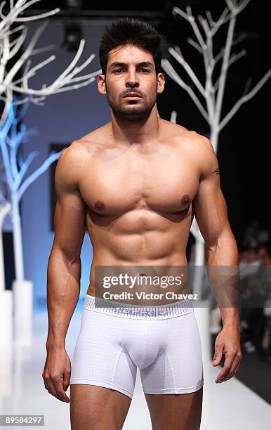 Model walks the runway wearing Tarrao during the 3rd day of Colombia Moda 2009 at Plaza Mayor on July 29, 2009 in Medellin, Colombia.