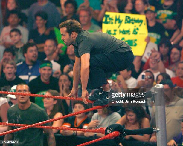 Actor Jeremy Piven, who was the guest host of WWE's "Monday Night Raw" at Mohegan Sun, prepares to leap on John Cena on August 3, 2009 in Uncasville,...