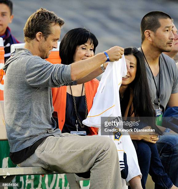 Lisa Ling the sister of imprisoned journalist Laura Ling mother Mary Ling and Lain Clayton, Laura Ling's husband look on prior to the start of the...