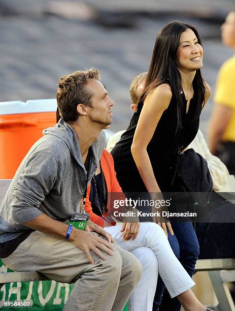 Lisa Ling , the sister of imprisoned journalist Laura Ling, mother Mary Ling and Lain Clayton, Laura Ling's husband look on prior to the start of the...