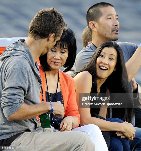 Lisa Ling the sister of imprisoned journalist Laura Ling, mother Mary Ling and Lain Clayton, Laura Ling's husband look on prior to the start of the...