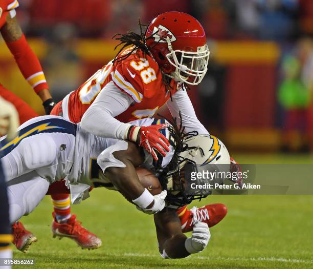 Free safety Ron Parker of the Kansas City Chiefs tackles running back Melvin Gordon of the Los Angeles Chargers during the first half at Arrowhead...