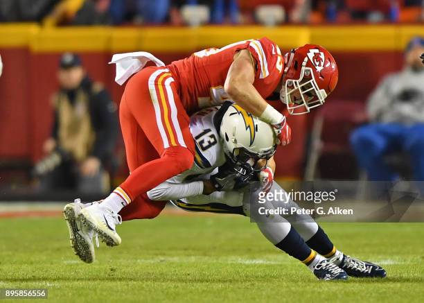 Strong safety Daniel Sorensen of the Kansas City Chiefs tackles wide receiver Keenan Allen of the Los Angeles Chargers during the first half at...