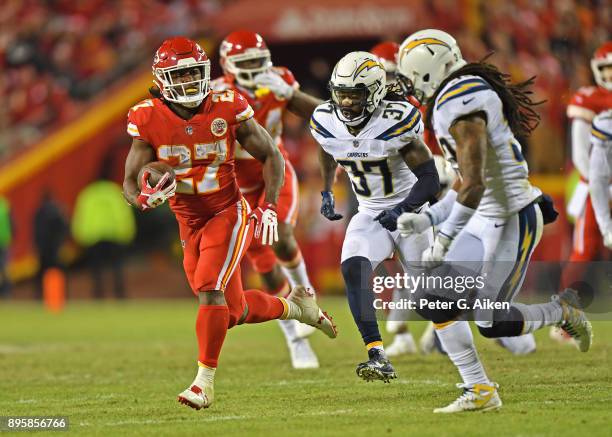 Running back Kareem Hunt of the Kansas City Chiefs runs up field against strong safety Jahleel Addae of the Los Angeles Chargers during the second...