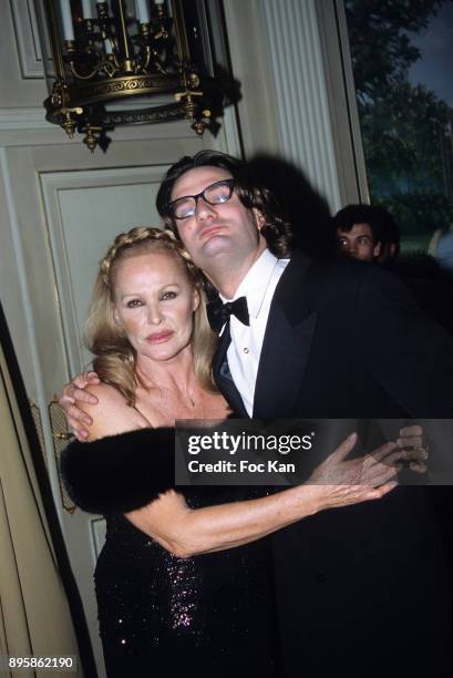Frederic Beigbeder and Ursula Andress attend a Dinner at Le Royal Monceau in the 1990s in Paris, France.