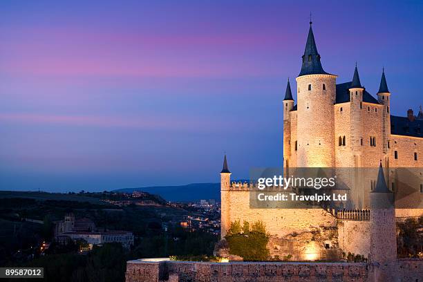 segovia castle illuminated - alcazar castle stock pictures, royalty-free photos & images