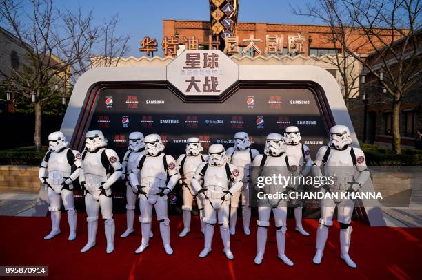 Stormtroopers pose at the red carpet for the Chinese premiere of 'Star Wars: The Last Jedi' at the Shanghai Disney Resort in Shanghai on December 20,...