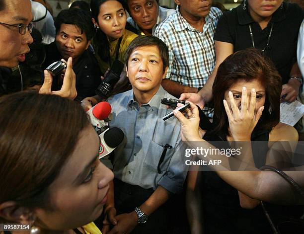 Ferdinand 'Bong-Bong' Marcos Jr. And Imee Marcos , the children of the late Philippine president Ferdinand Marcos, are surrounded by reporters after...