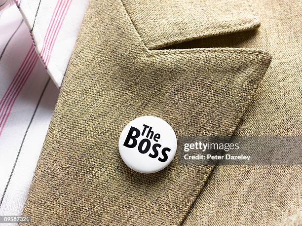 'the boss' button badge - jacket stock pictures, royalty-free photos & images