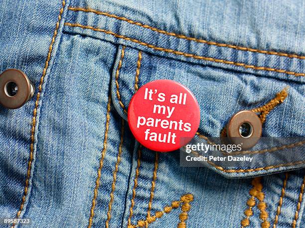 'it's all my parents fault' badge. - intrusion stock pictures, royalty-free photos & images