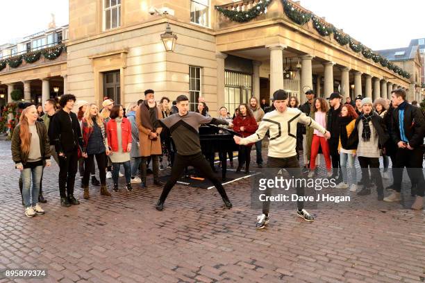 Dance duo Twist and Pulse perform at 'The Greatest Showman' flashmob at Covent Garden on December 18, 2017 in London, England.