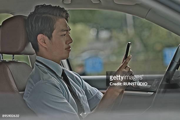 businessman using cell phone in car - wap stock pictures, royalty-free photos & images