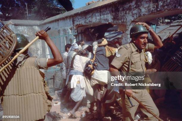 Police push back Hindu activists from entering into the Babri Mosque, Ocotber 30, 1990 in Ayodhya, India. The Hindu right-wing party, Bharatiya...