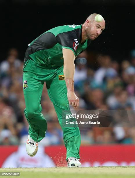 Melbourne Stars player John Hastings bowls the ball during the Big Bash League match between the Brisbane Heat and the Melbourne Stars at The Gabba...