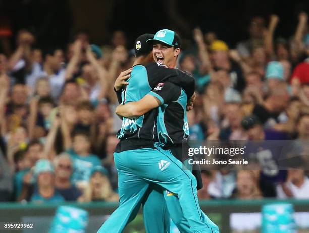 Brisbane player Mitch Swepson celebrates taking a catch during the Big Bash League match between the Brisbane Heat and the Melbourne Stars at The...