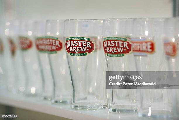 Branded beer glasses are displayed for sale at the Great British Beer Festival on August 4, 2009 in London. The festival is organised by CAMRA who...