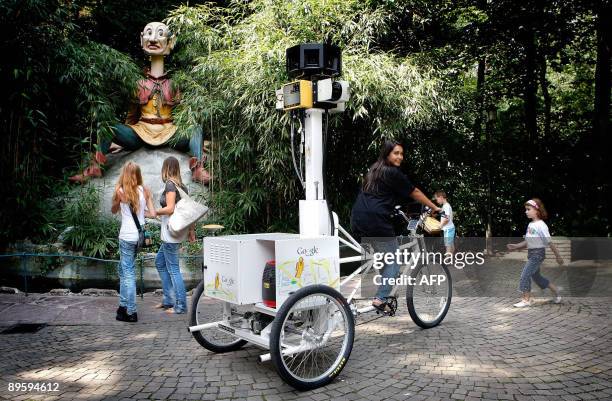 Woman pedals a tricycle fitted with a special camera in the Efteling, the largest theme park in the Netherlands on August 4, 2009. The images are...