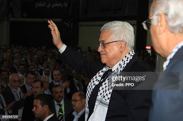 In this handout image provided by the Palestinian Press Office , Palestinian President and Fatah leader Mahmoud Abbas waves to party members during...