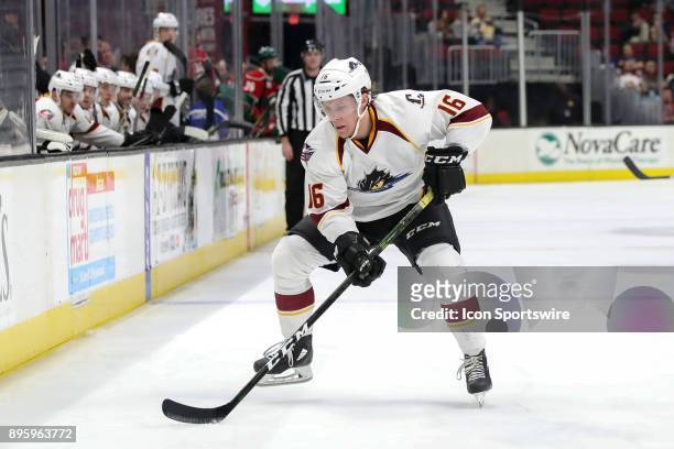Cleveland Monsters right wing Miles Koules plays the puck during the second period of the American Hockey League game between the Iowa Wild and...