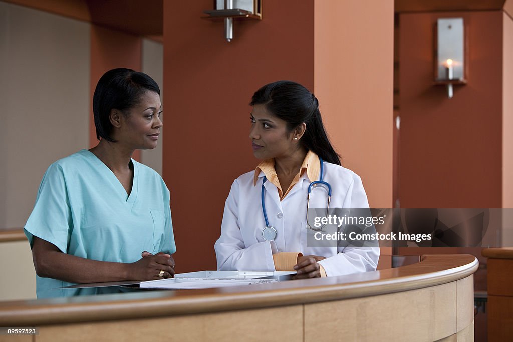 Nurse talking to doctor