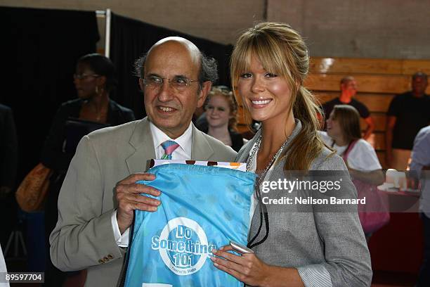 Chancellor of New York City Schools, Joel l. Klein and recording artist Leah Renee attend the Staples Do Something 101 School Supply Drive at...