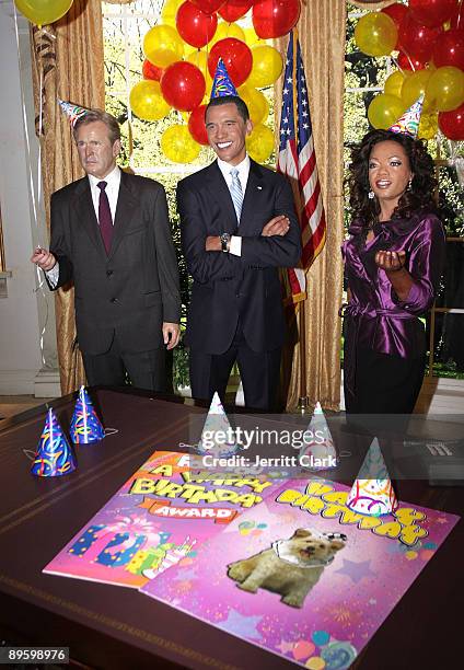 George W. Bush, President Barack Obama and Oprah Winfrey wax figures seen during a celebration of President Barack Obama's first birthday in office...