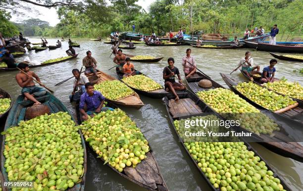 People sell guava at the local market of Barishal District of Bangladesh. They are overcoming unemployment by plant & harvest guava on self-employed.