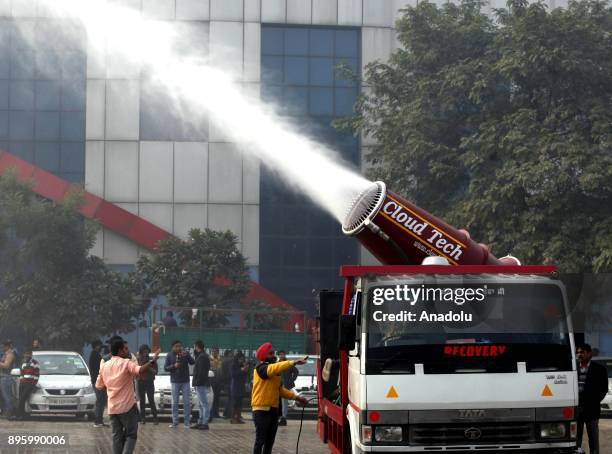 Anti-smog gun, a device that sprays water into the air to reduce pollution, being tested in Anand Vihar area of New Delhi, India on December 20,...