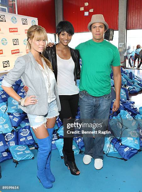 Leah Renee, Ciara, and Chaske Spencer help assemble bags of supplies for the 2nd Annual Staples / Do Something 101 National School Supply Drive at...