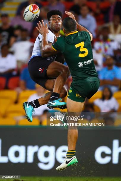 Kevin Naiqama of Fiji and Will Chambers of Australia leap to contest a high ball during the Rugby League World Cup men's semi-final match between...