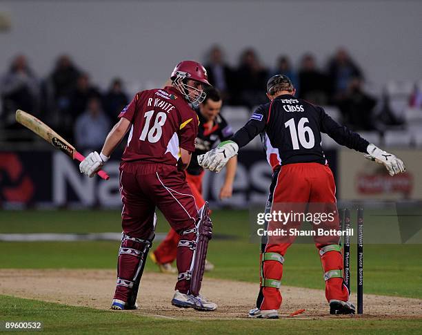 Rob White of Northamptonshire is bowled off the bowling of Stephen Parry of Lancashire as wicketkeeper Gareth Cross looks on during the NatWest Pro40...