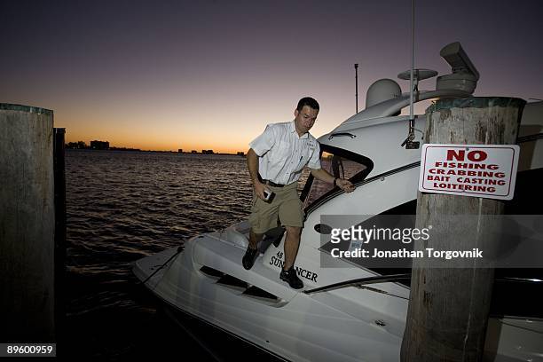 Louis Almeida, a repossession agent working for National Liquidators the worlds largest boat and yacht liquidation company, during a voluntary...