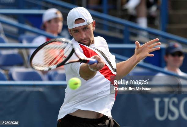 Benjamin Becker of Germany returns a shot to Robby Ginepri during Day 2 of the Legg Mason Tennis Classic at the William H.G. FitzGerald Tennis Center...