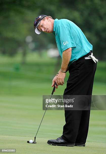 Woody Austin prepares to putt at the first green during practice for the World Golf Championships-Bridgestone Invitational held at Firestone Country...