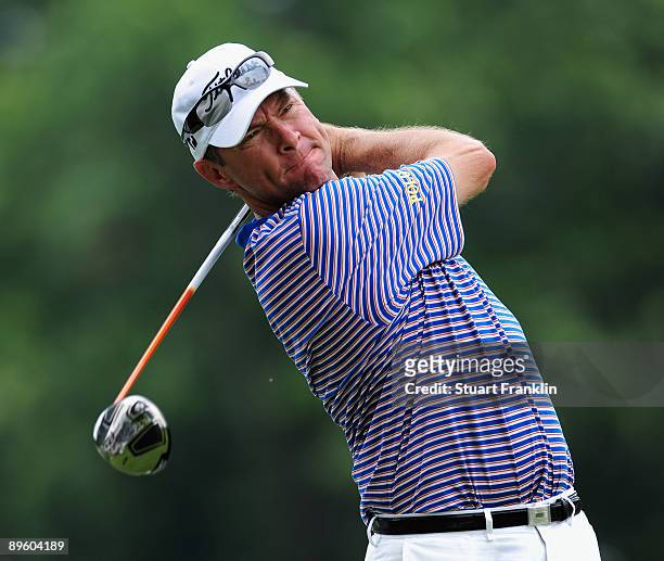 Davis Love III of the U.S. Plays his tee shot during a practice round of the World Golf Championship Bridgestone Invitational on August 4, 2009 at...